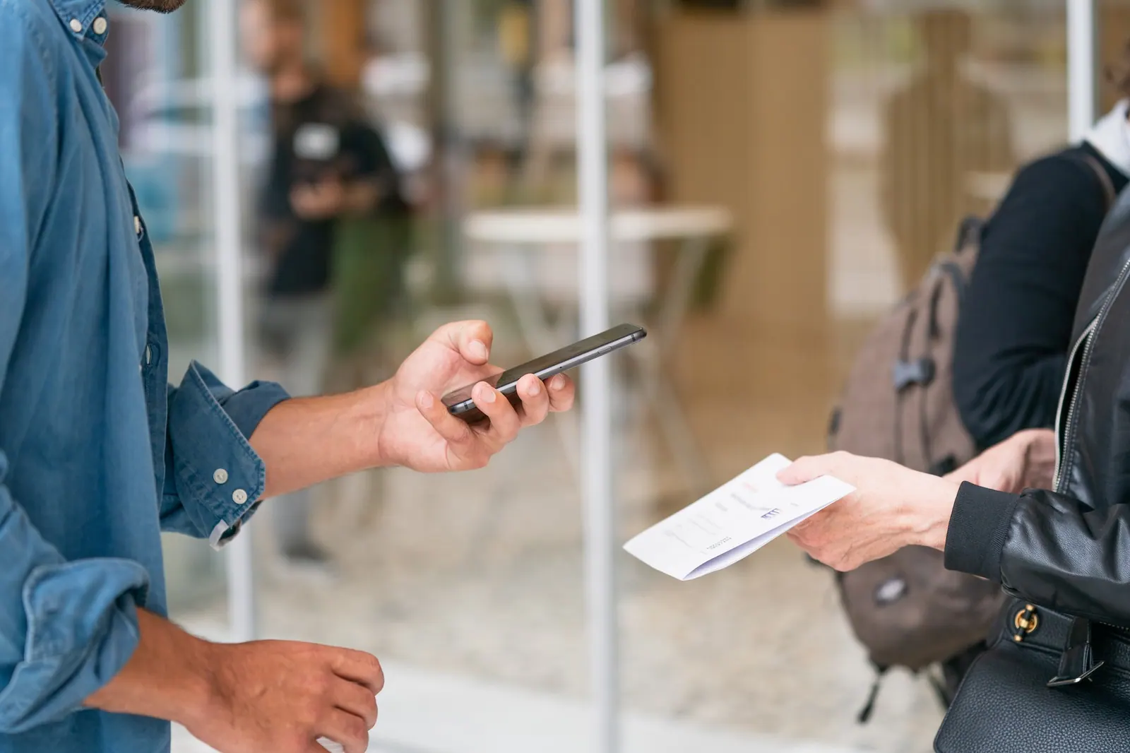 invoice OCR being done by a man with a smartphone